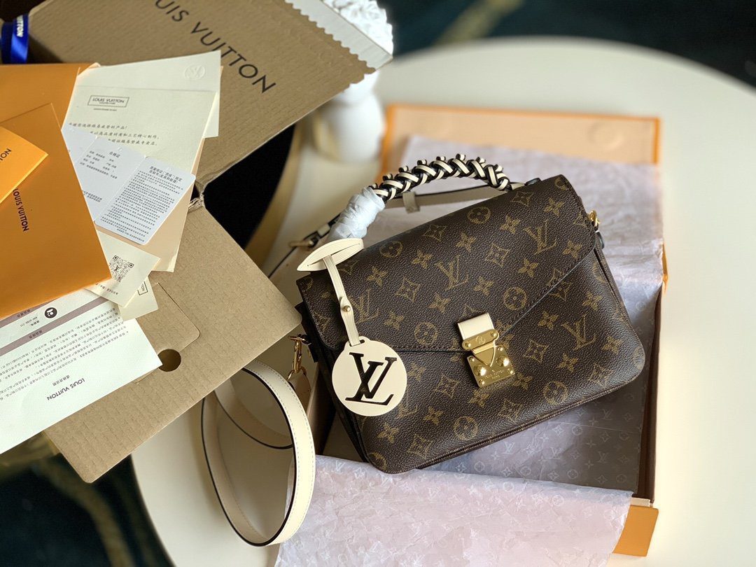 Replica Louis Vuitton M45152 Pochette Metis Monogram Canvas Features a Braided-Leather Top Handle