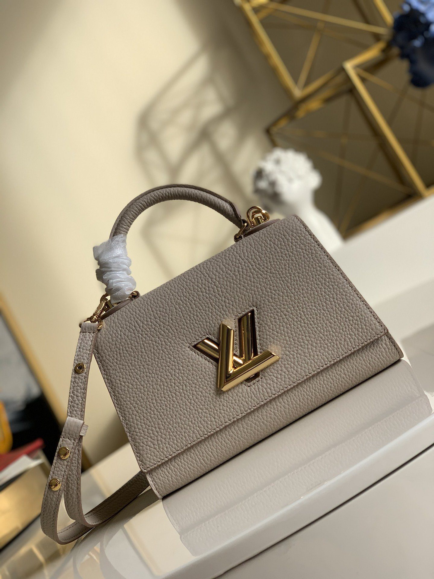 Replica Louis Vuitton M57214 Twist One Handle PM Taurillon Leather Greige