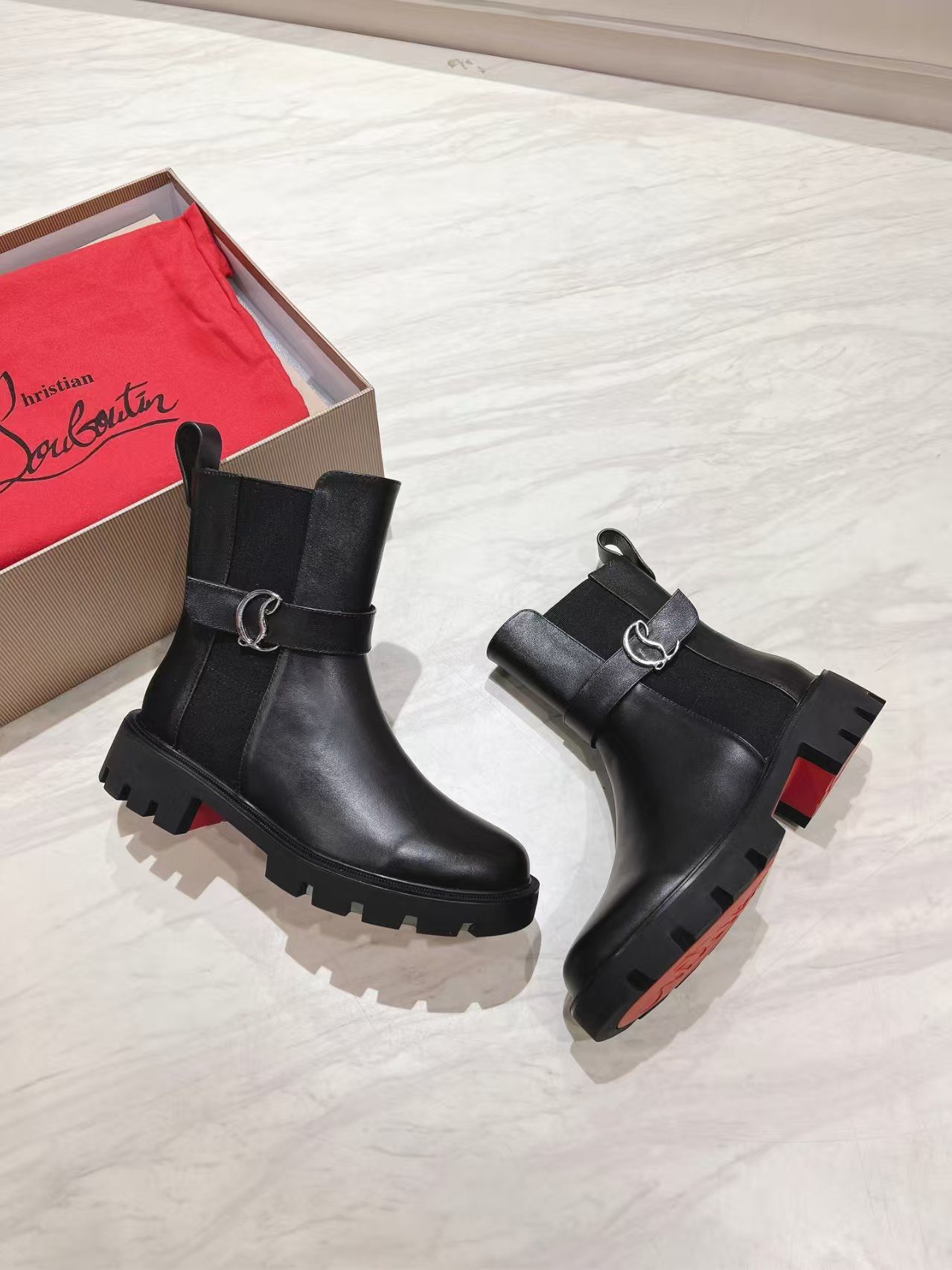 Christian Louboutin CL Chelsea Booty Lug boot in black calf leather